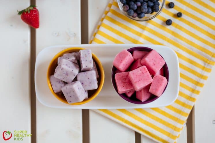 Pink and purple frozen berry yogurt cubes